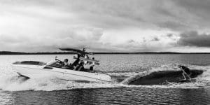 Supra wake boat creating a surf wave